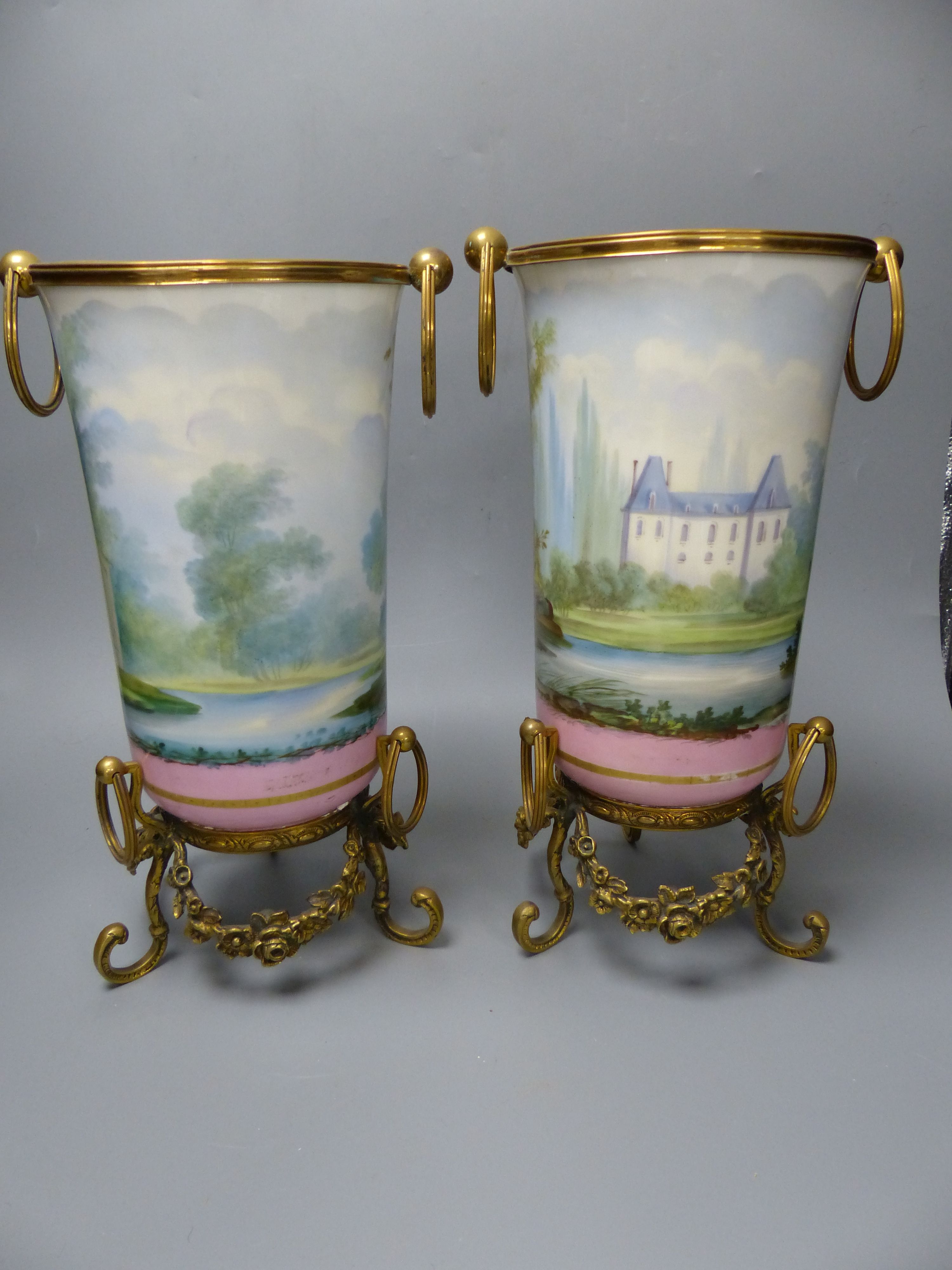 A pair of late 19th century Paris porcelain and gilt metal mounted vases, height 33cm